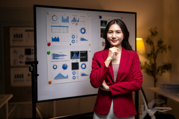 Businesswoman presenting data analysis in modern office