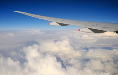 Airbus A350 900 wing and clouds during cruise
