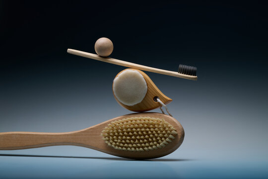 Creative still life of balanced wooden objects on gradient background