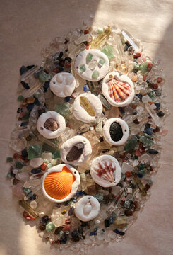 Unique homemade clay ornaments with materials in the sunlight.