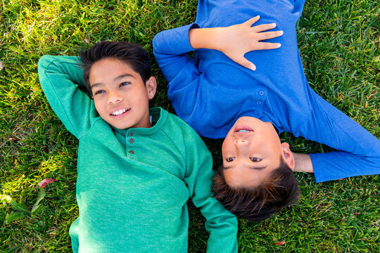 kids relaxing on grass