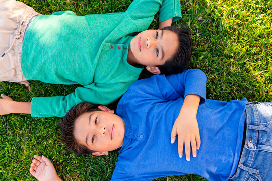 kids relaxing on grass
