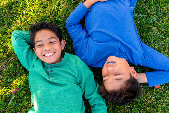 kids relaxing on grass