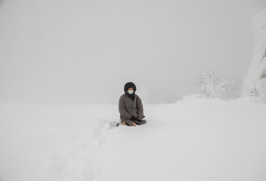 A Smile in the Midst of Winter: A Woman Resting in the Snow.