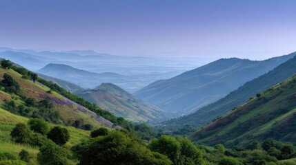 Fototapeta premium Serene Landscape of Rolling Mountains Under a Soft Blue Sky with Gentle Hues and Vast Greenery Inviting Adventure and Exploration in Nature's Realm
