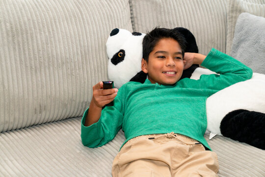boy watching tv remote