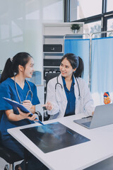 Medical, meeting and laptop for team in office in discussion, brainstorming and planning. Doctor, nurse and computer on desk, teamwork or workshop for Model Internal organ.