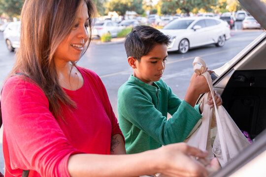 loading groceries into car 