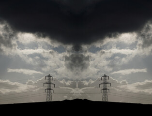 Electric power towers suppling cities and home throughout the world with electricity and Infrastructure with dramatic clouds and sky background