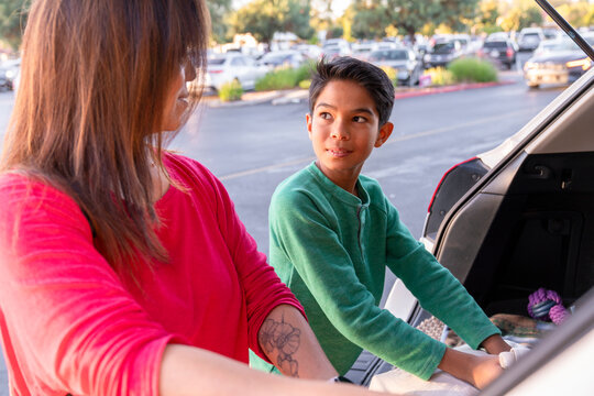 loading groceries into car 