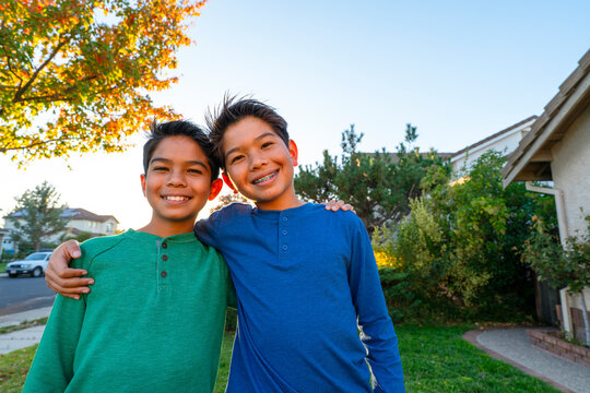 two happy brothers smiling 