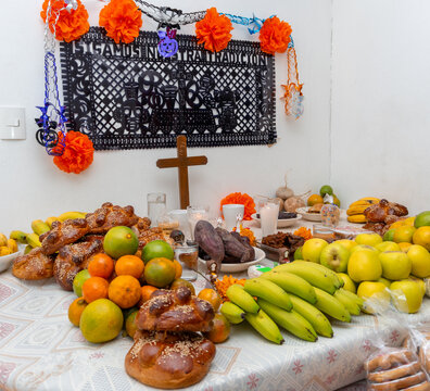 Day of the dead altar offering traditional mexican food