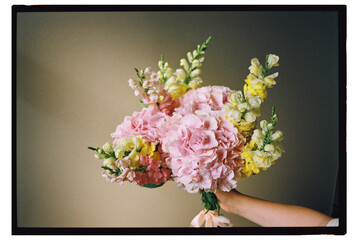 Beautiful spring bouquet held in gentle hands