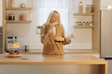 Woman trying a biscuit cookie