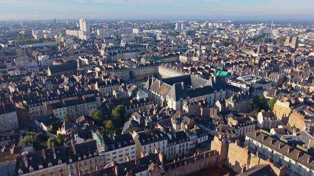 Drone pull-away frames Rennes historic city center with Parlement Bretagne, Town Hall Op&eacute;ra monument, Palais Commerce and integrated dense medieval Renaissance architecture Brittany, France.​