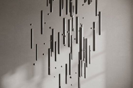 Abstract installation with scattered bars and soft shadows