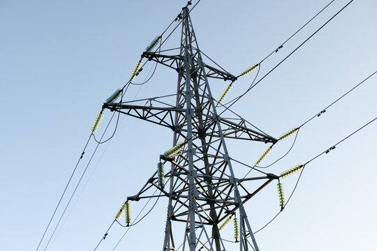 High Voltage Power Tower Against Clear Blue Sky