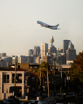 Airliner Departing Sydney with City Skyline