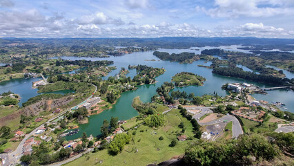 Panoramic view of Guatape lake area, (Penol) Colombia, South America cloudy day amazing tree area in middle of lake 7
