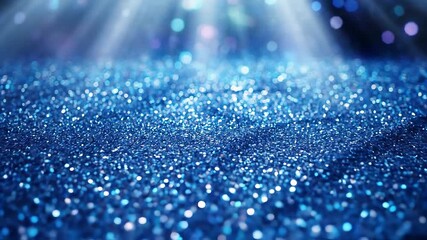 A mesmerizing closeup of shimmering blue glitter illuminated by ethereal light rays from above creating a magical and sparkling abstract background perfect for festive celebrations luxurious events o.