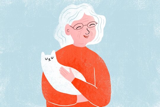 Happy elderly woman with a cat