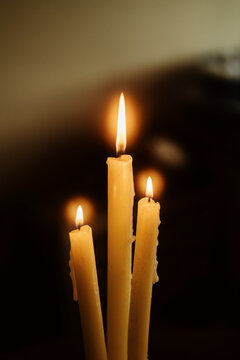 Warm Candlelight Creating a Cozy Atmosphere in a Dim Space
