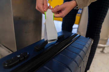 Anonymous Man Tags Luggage at Airport Self Drop Service