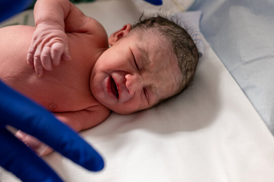 Newborn Baby Crying After Birth In Hospital Room