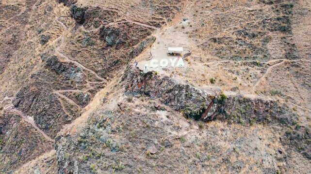 Drone lookout coya glass bridge Aerial view of Village of Coya and the Urubamba river, Sacred Valley, Cusco, Peru