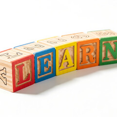 Square close up of wooden toy blocks with letters on a white surface