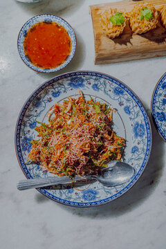 Assorted Nyonya dishes on dining table in Malaysia