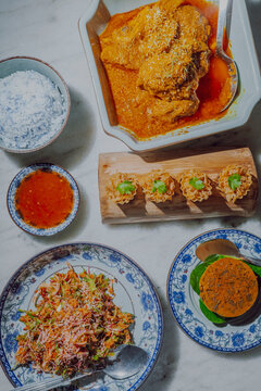 Assorted Nyonya dishes on dining table in Malaysia