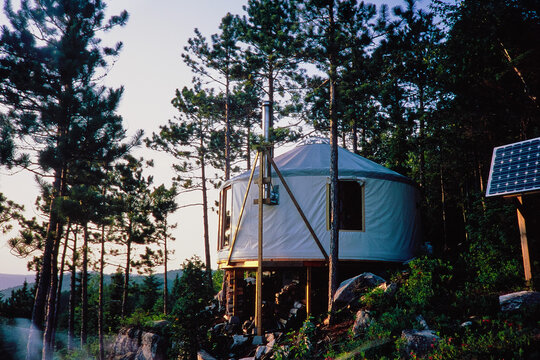 Off-Grid Yurt with Solar Panel in Forest