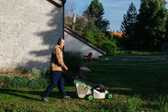 Senior Man Lawn Mowing