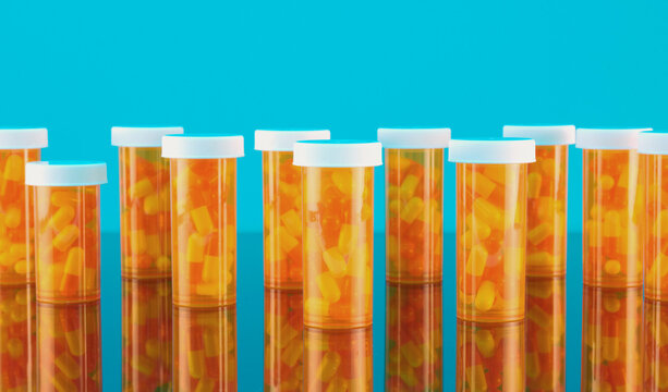 Capsules in Bottles with Reflection