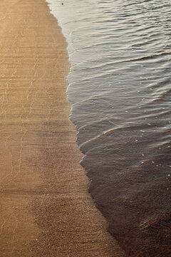 Wet Sand Line and Shimmering Sea