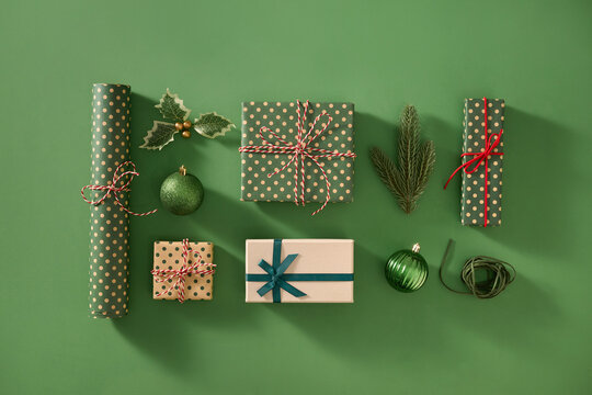 Christmas presents and decorations arranged on a vibrant green