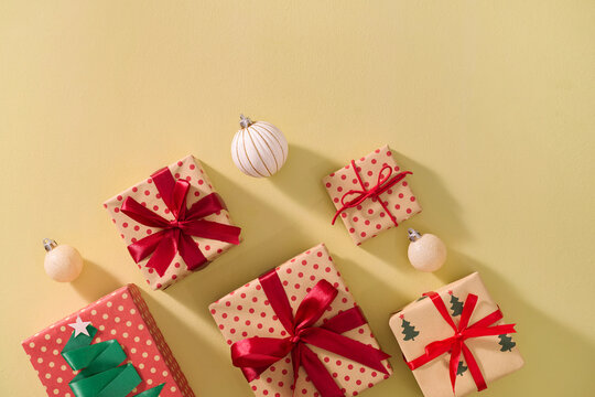 A festive arrangement of wrapped Christmas gifts with ribbons