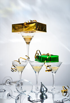 Celebration Setup With Festive Drinks and Wrapped Shiny Gifts