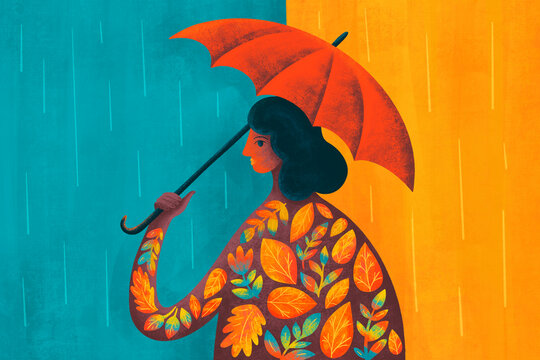 Woman with colorful umbrella walking in the rain