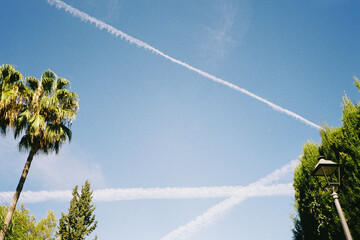 Contrails Crossing in Blue Sky
