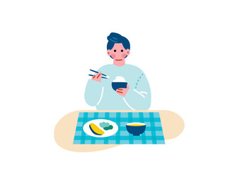 食事をする若い男性