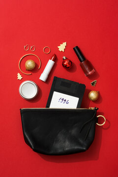 Christmas party concept with gold and red accessories and floppy disk