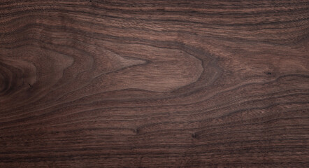 Walnut wood texture background. Wide format black walnut natural texture desktop background.