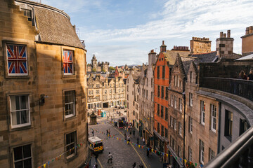 Vibrant Edinburgh Street With Historic Buildings by Day