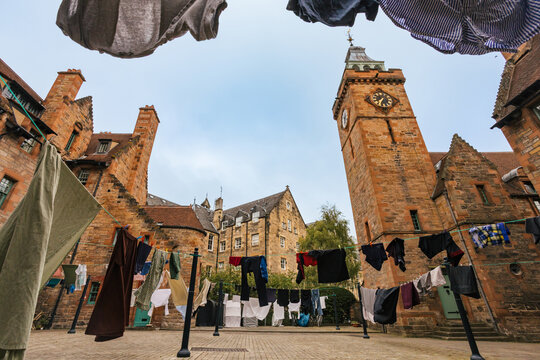 Historic Courtyard With Clothes Hanging in the Breeze During Daytime