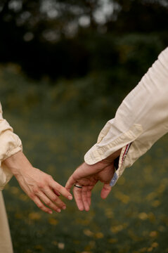 Couple's Hands Almost Touching