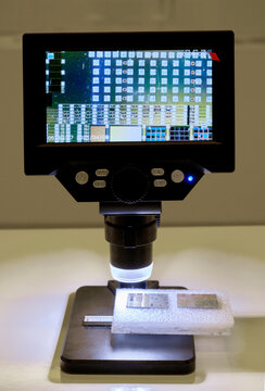 A tiny chip magnified under a microscope