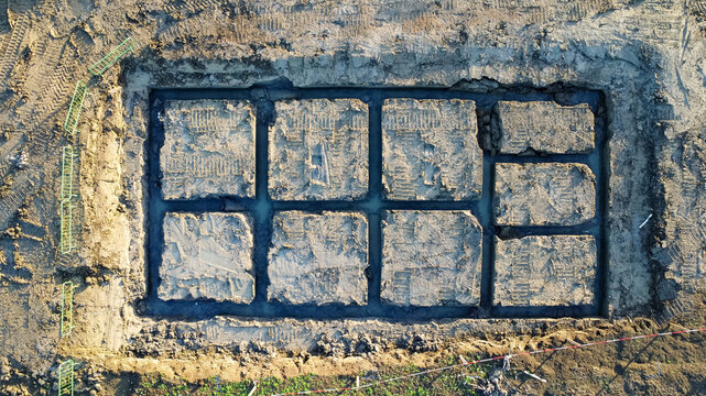 Aerial view of foundations for houses on a  housing estate, UK
