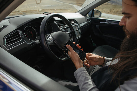Driver uses phone inside car